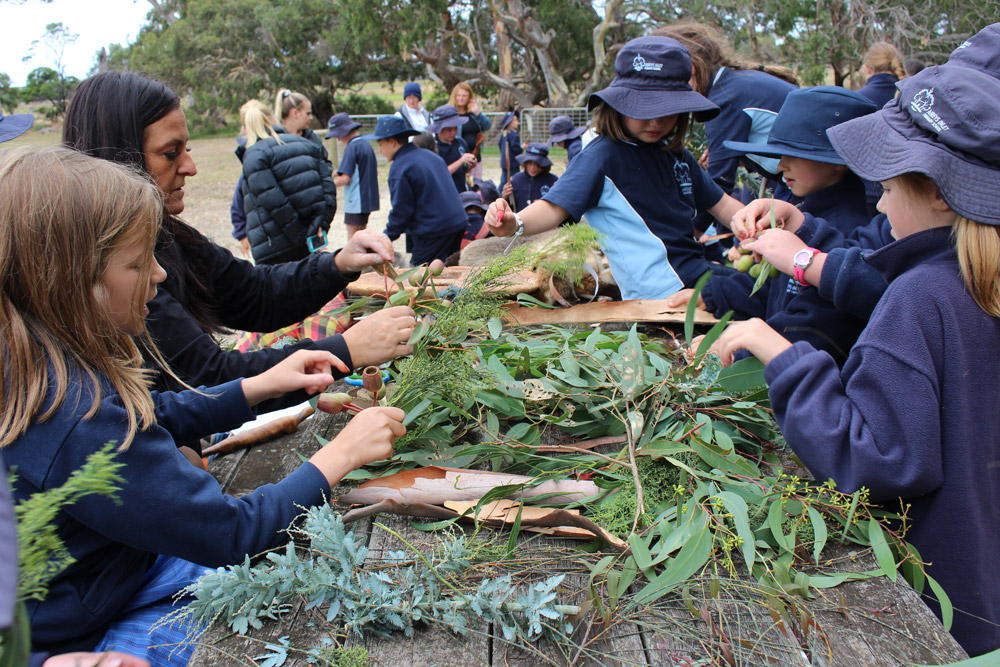 Students making bouquets of indigenous foliage during Wathaurong/Waddawurrung cultural excursion