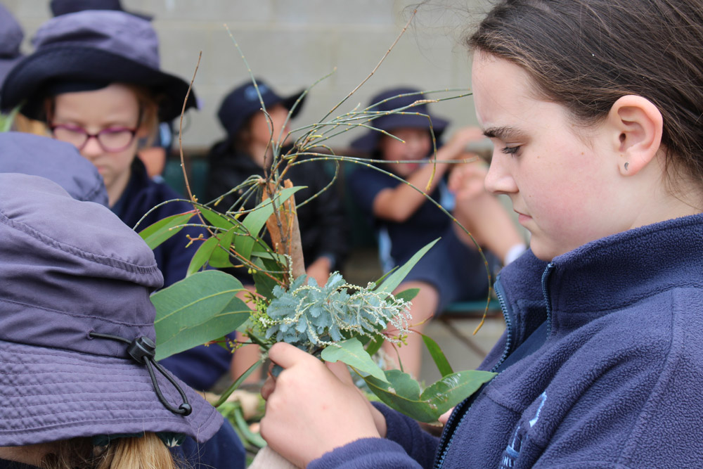 Students making bouquets of indigenous foliage during Wathaurong/Waddawurrung cultural excursion
